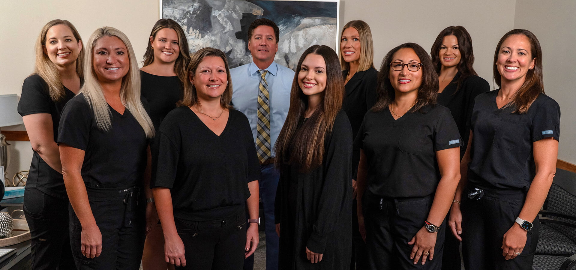 The Darryl A. Field, DDS dental team posing outside